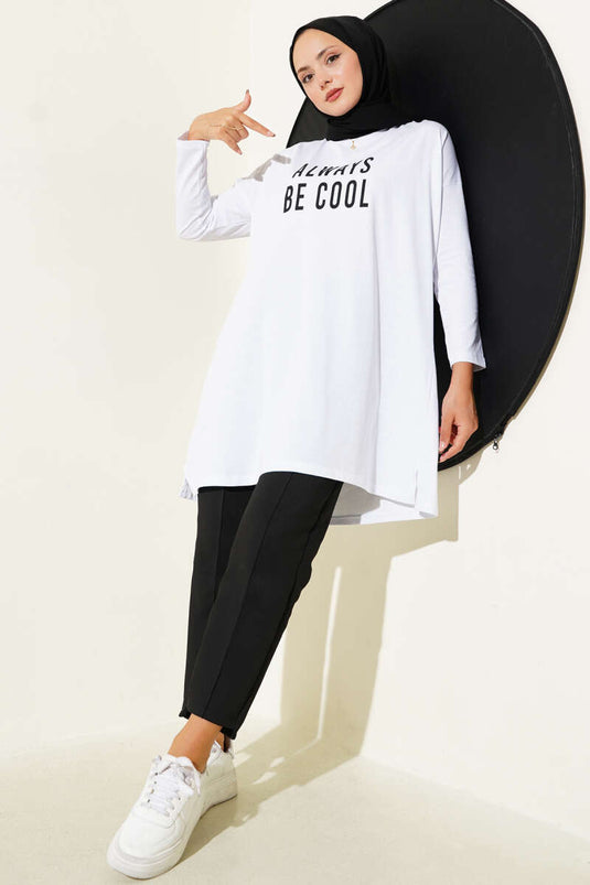 تونيك أبيض مطبوع عليه عبارة "كن دائمًا رائعًا"