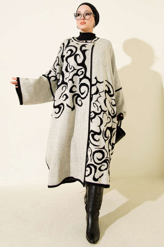 بونشو أنجورا بأزرار وياقة مفصلة باللون الأسود والبيج