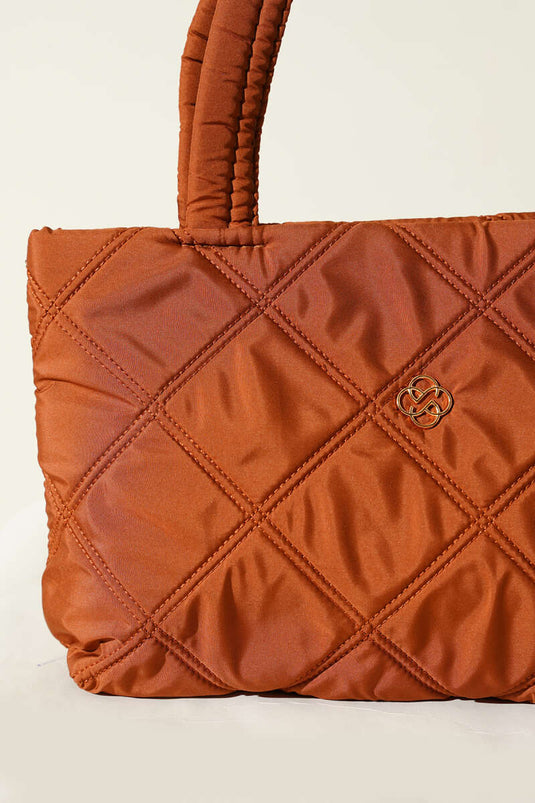 Dames handtas met kapitone en gesp, tabakskleurig