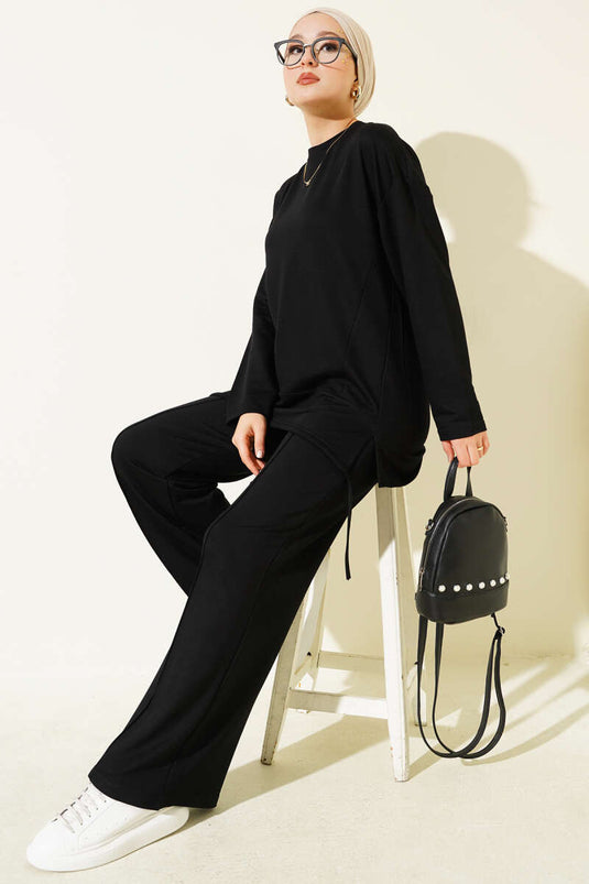 Ensemble deux pièces noir à col rond avec coupe asymétrique