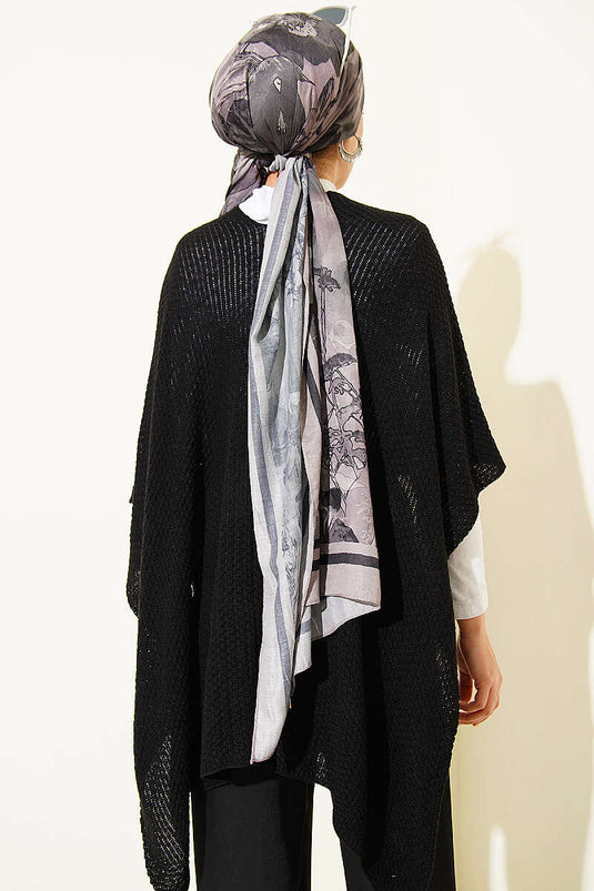 Poncho in maglia a taglio asimmetrico nero