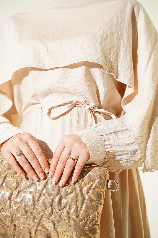 Vestido Beige Asimétrico Con Detalles En Los Hombros