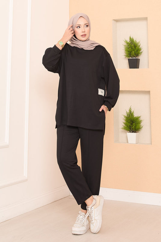 Maillot deux pièces Oysho noir avec emblème à fente asymétrique