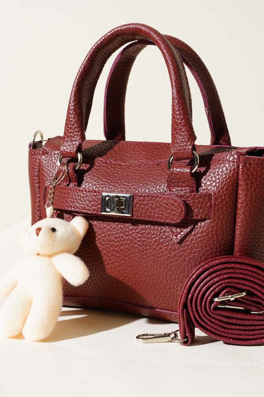 Sac à fermeture éclair avec accessoires ours en peluche, rouge bordeaux