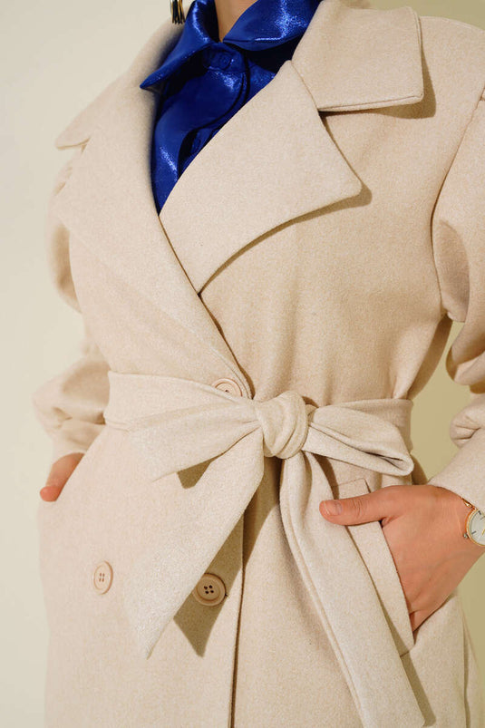 Manteau en cachemire beige à manchettes ballon