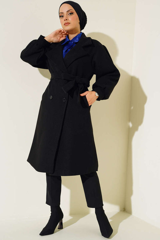 Manteau en cachemire noir à boutons de manchette et manches ballon