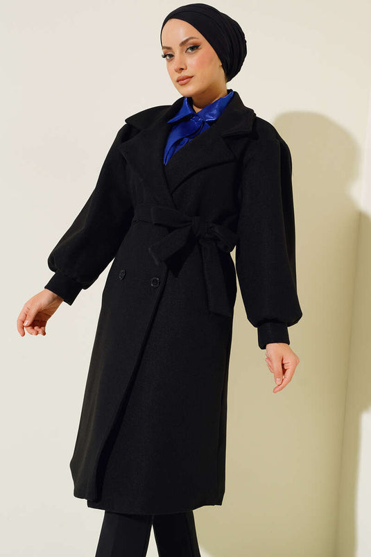 Manteau en cachemire noir à boutons de manchette et manches ballon