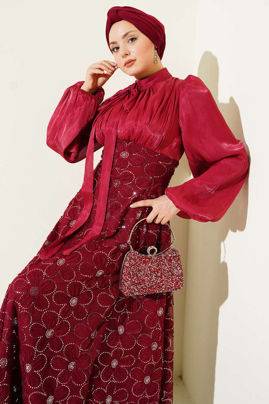 Abito da cerimonia bordeaux con maniche a palloncino e fiori ricamati