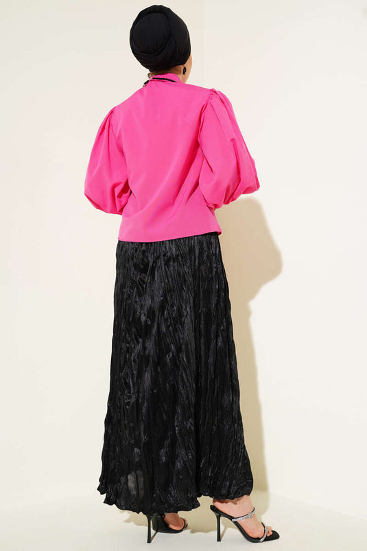 قميص وردي بأكمام منفوخة