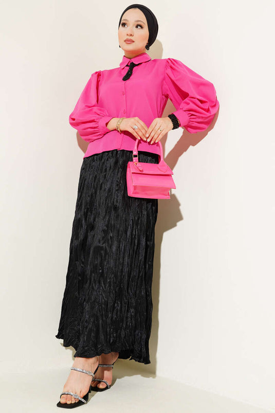 قميص وردي بأكمام منفوخة