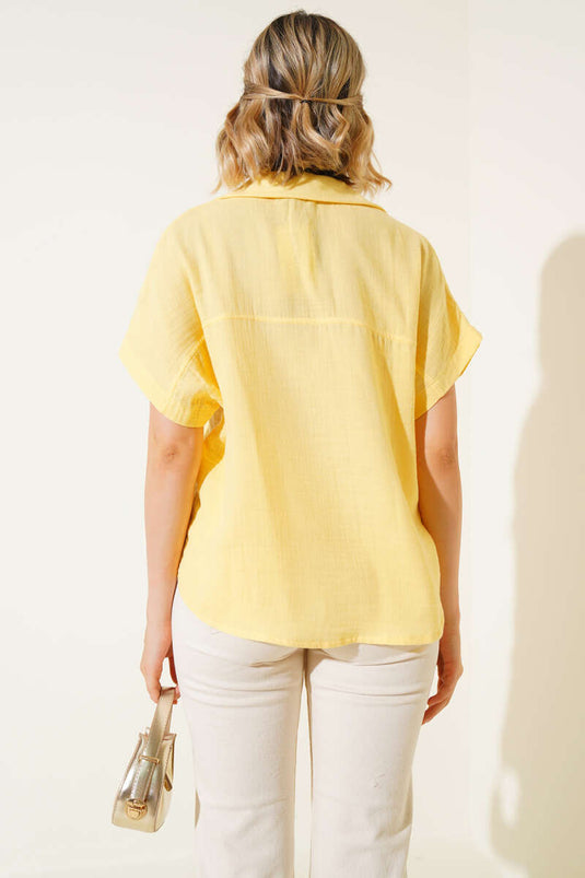 قميص أصفر أساسي بأزرار