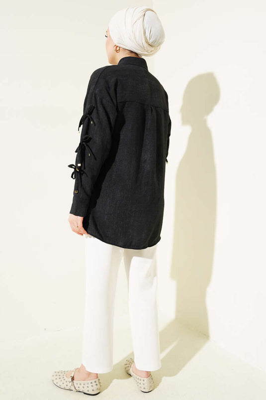 Chemise noire à manches et nœud à motif batik