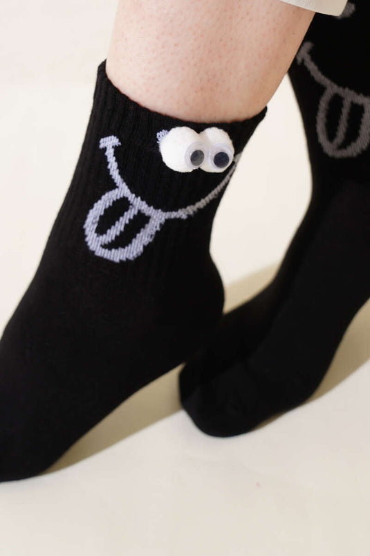 Schwarze verspielte Socken mit Augenhöhlenmotiv für Damen