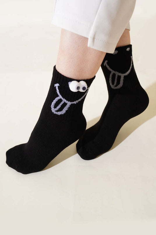 Schwarze verspielte Socken mit Augenhöhlenmotiv für Damen