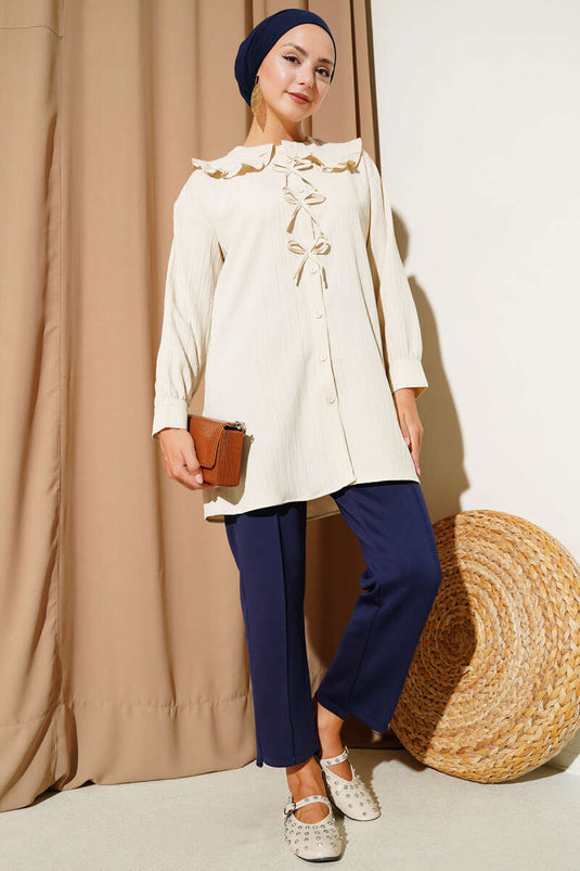 قميص بفيونكة للبنات الصغيرات باللون البيج