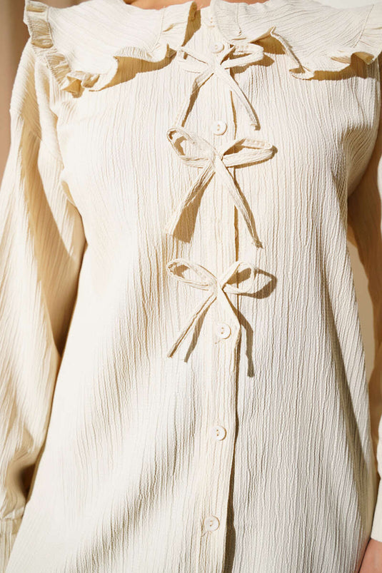 قميص بفيونكة للبنات الصغيرات باللون البيج