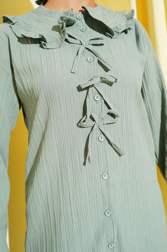 قميص بياقة رضيع مع فيونكة باللون الأخضر اللوزي