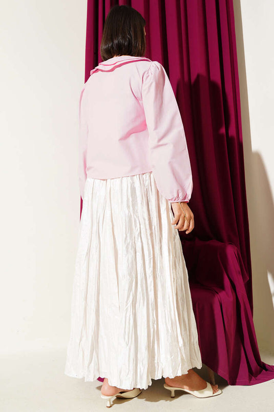 قميص قصير وردي اللون مع فيونكة للبنات