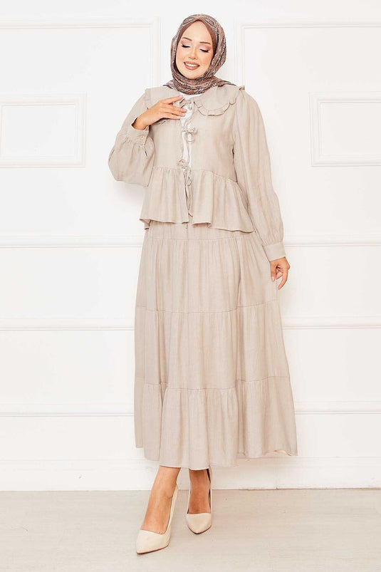 Ensemble jupe et col bébé beige à nouer sur le devant