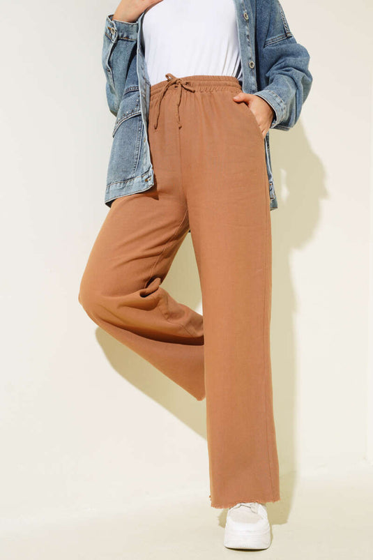 Pantaloni con nappe e lacci in vita Visone