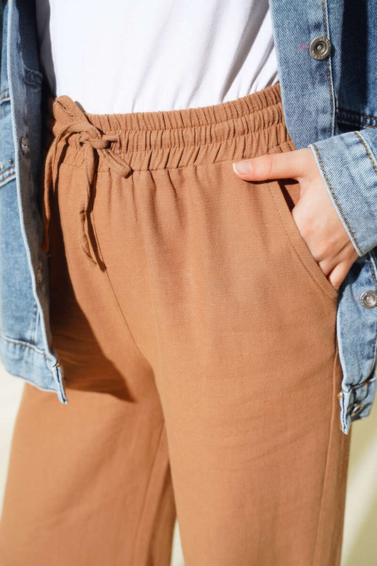 Pantaloni con nappe e lacci in vita Visone