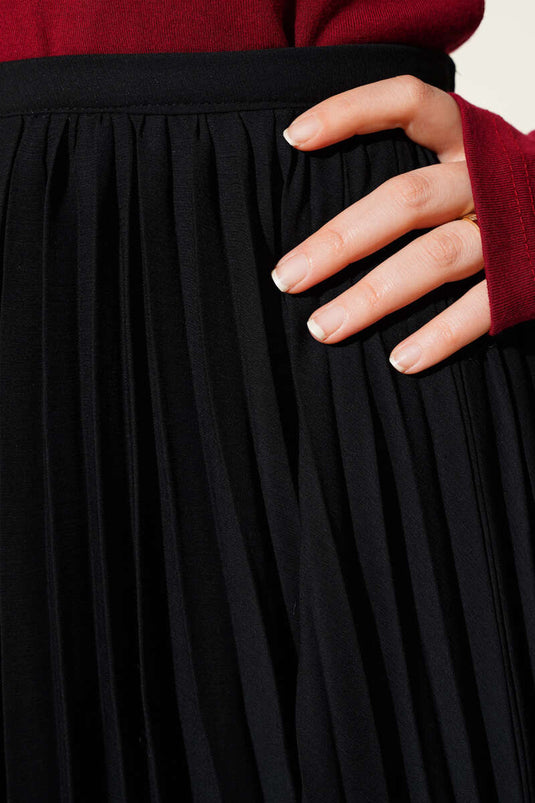 Jupe plissée en mousseline noire avec fermeture éclair invisible