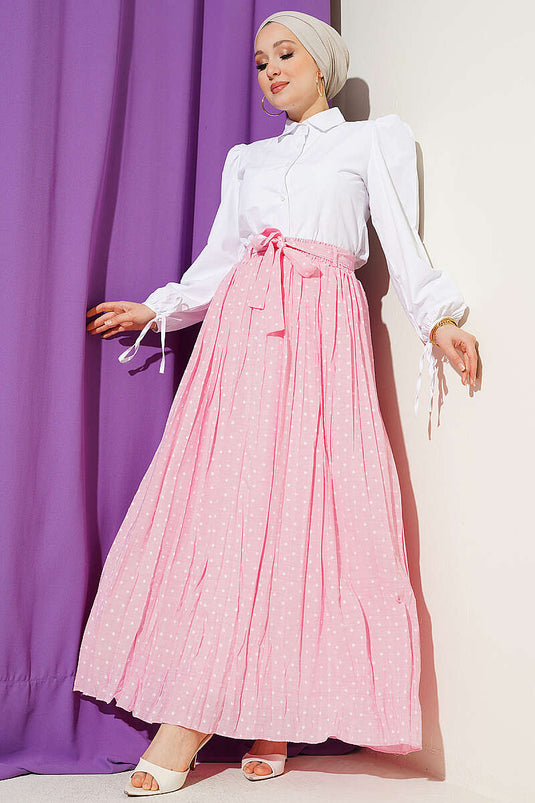 Jupe plissée à pois avec ceinture rose