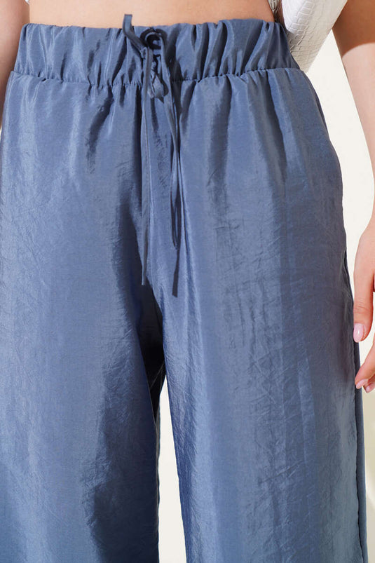 Pantalon brillant indigo à taille élastique et jambes larges