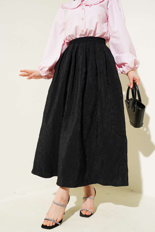 Jupe noire à poches plissée avec ceinture élastique
