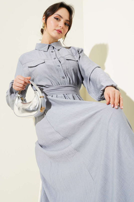 فستان رمادي اللون بجيوب وحزام وخصر مطاطي