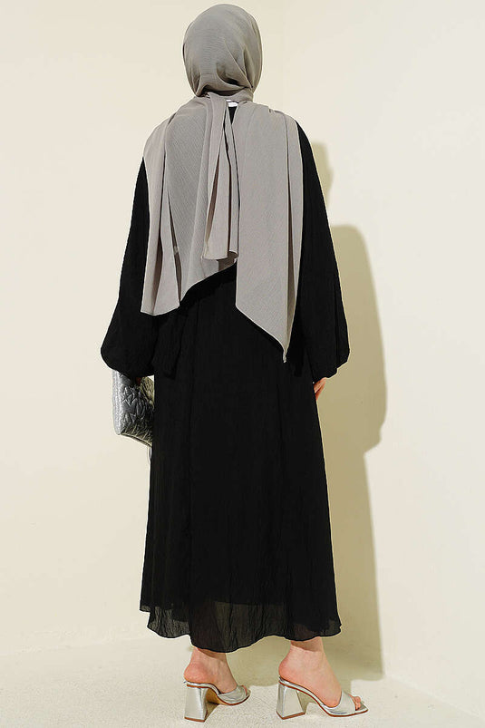 Robe noire à volants avec ceinture élastique
