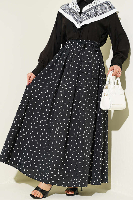 Jupe noire à pois avec ceinture élastique à la taille