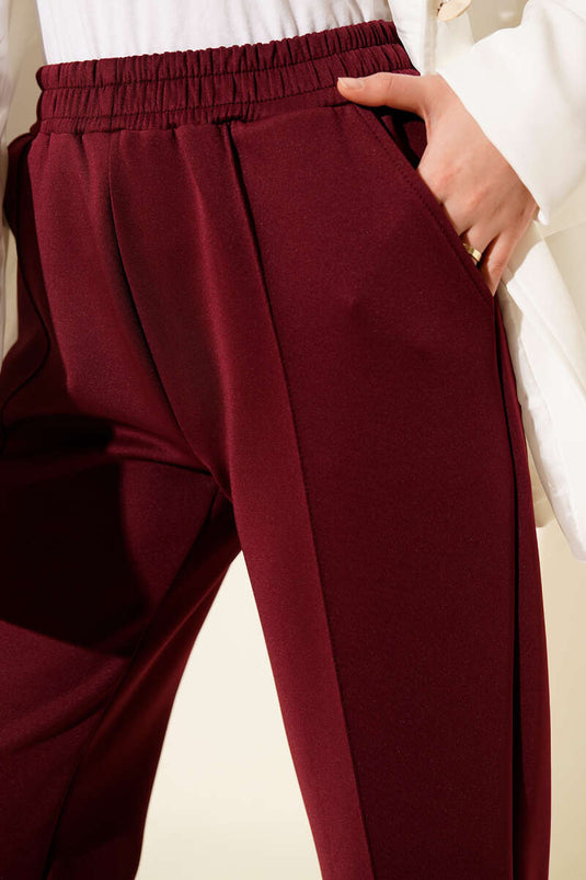 Pantalon de plongée bordeaux avec taille élastique et poches