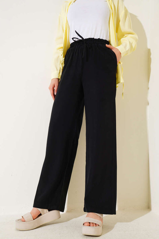 Pantalones de tencel con cintura elástica, color negro