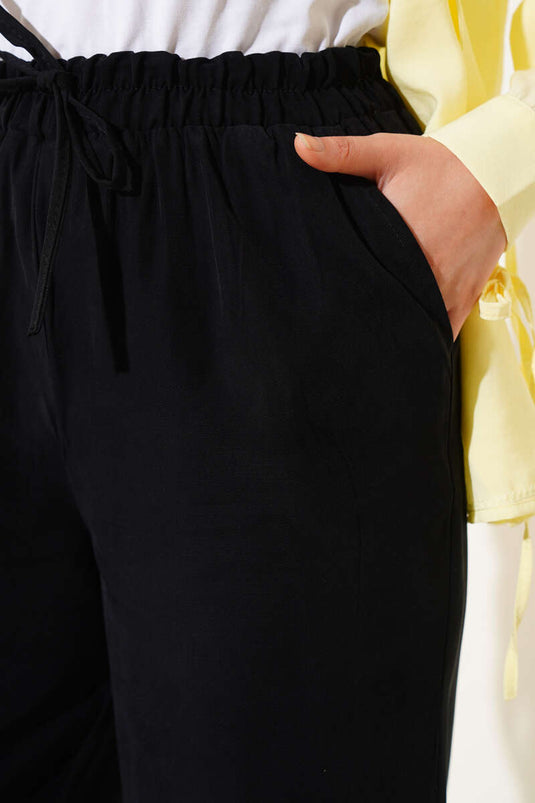 Pantalones de tencel con cintura elástica, color negro