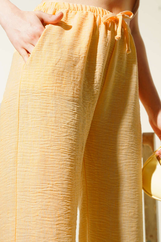 Pantalones de verano con cintura elástica en color naranja