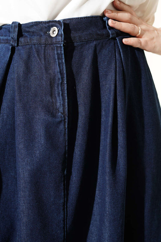 Gonna di jeans blu scuro con tasche e pieghe