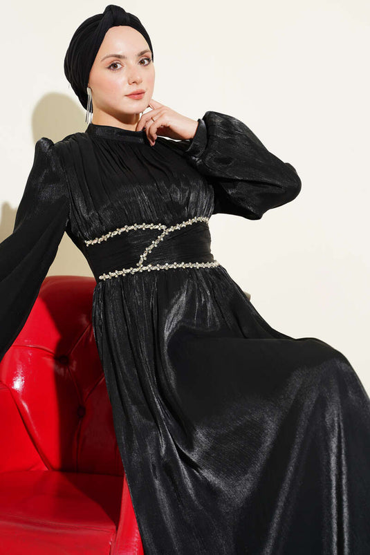 Abito da sera nero con coulisse e striscia decorata con pietre