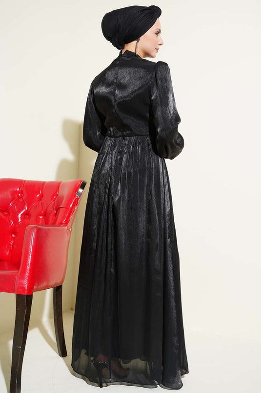 Abito da sera nero con coulisse e striscia decorata con pietre