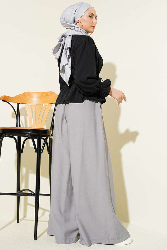 Chemisier court noir avec ceinture à ourlet et poignets élastiqués
