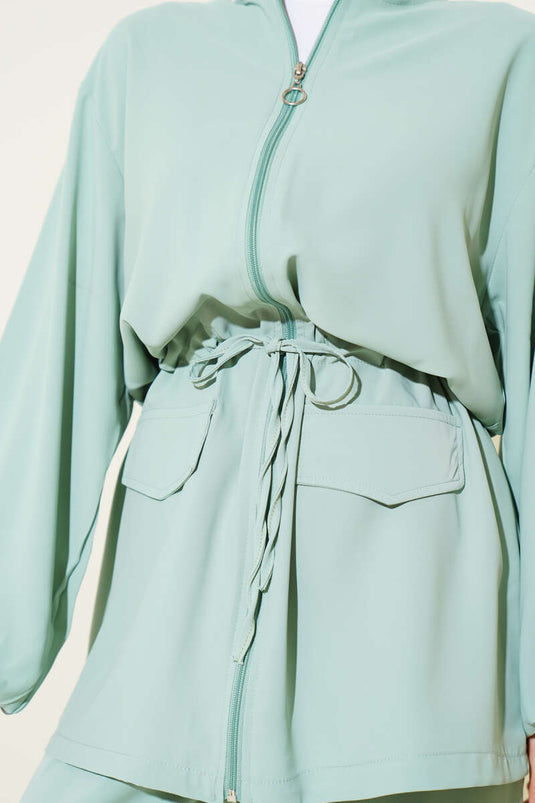 Combinaison deux pièces à rabat et poche zippée, taille tunnel, vert aqua