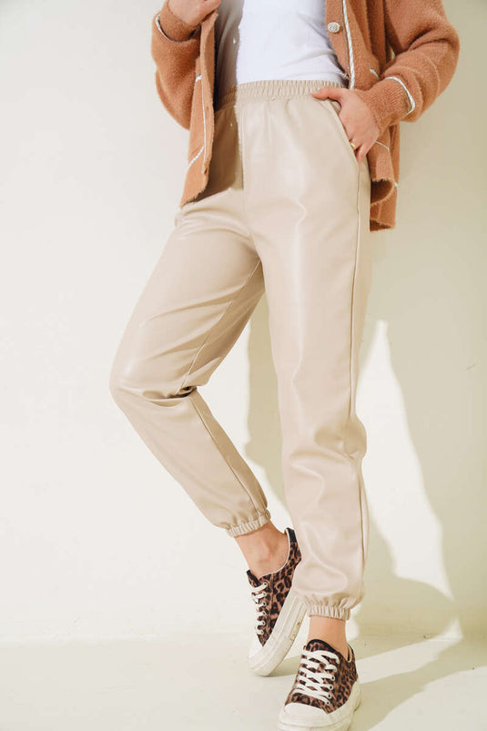 Pantalon en cuir élastique à la taille et aux jambes Beige