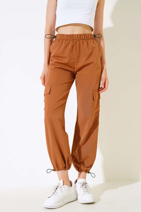 بنطلون باراشوت بخصر مطاطي وجيوب للساق بلون الجمل