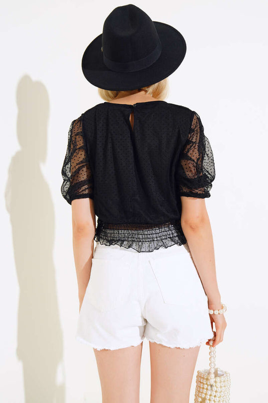 Schwarze Bluse aus Tüll mit Taillengürtel