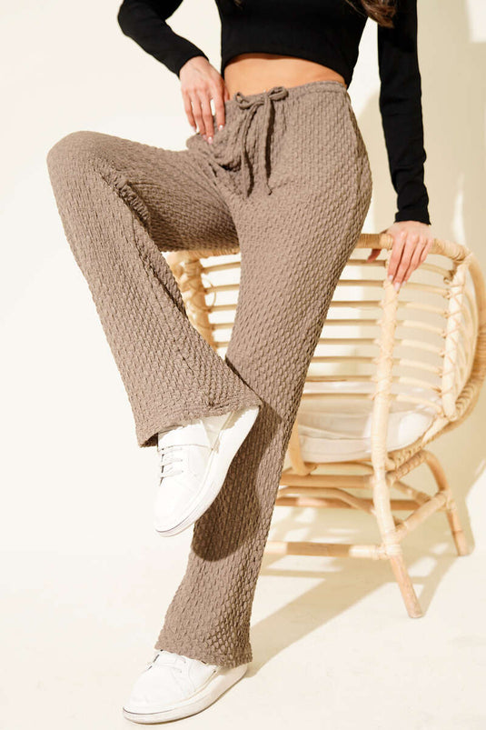 Mink-colored, elasticated waistband crepe trousers.