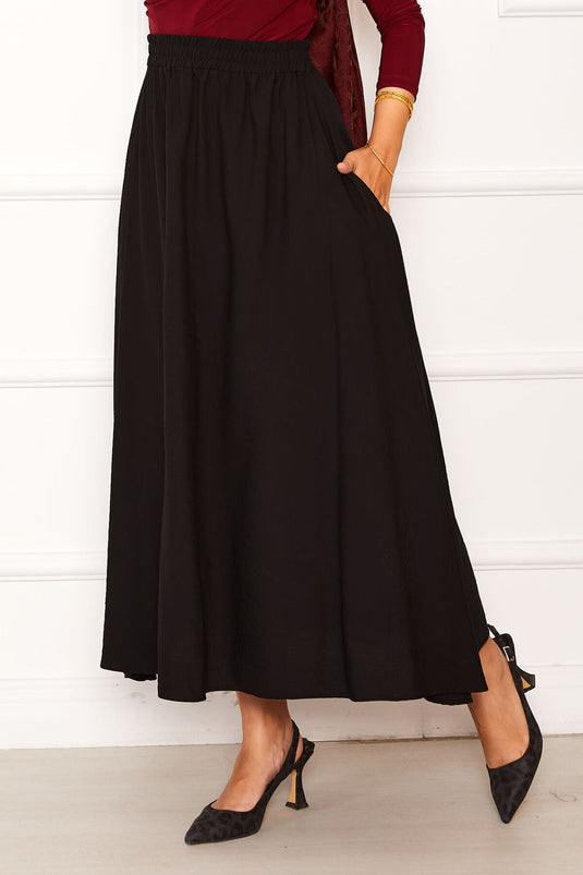 Jupe noire avec ceinture élastique et détails de poche