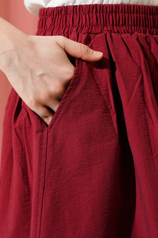 Jupe évasée bordeaux avec poches et ceinture élastique