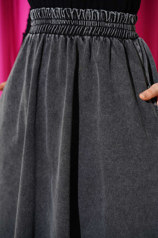 Jupe évasée en jean fumé avec poches et taille élastique