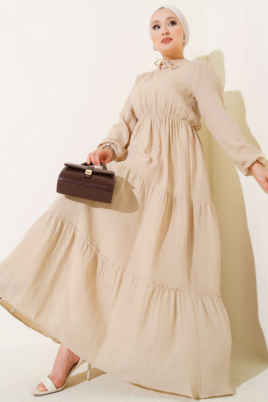 Robe beige à taille élastique et à volants