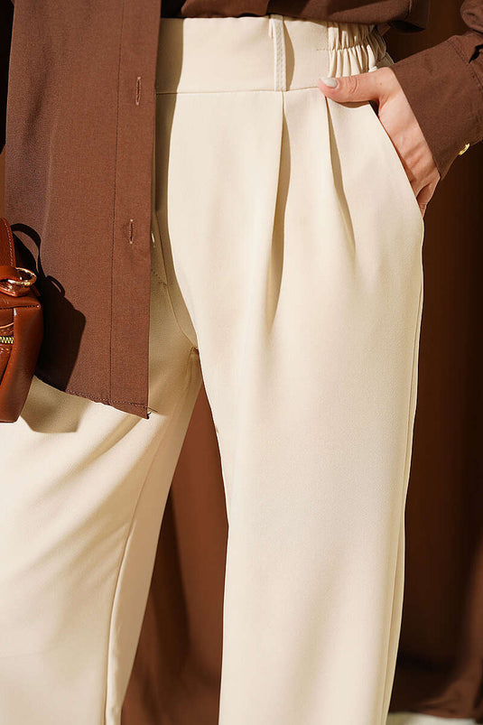 Achetez pantalon beige à taille élastique et plis avant